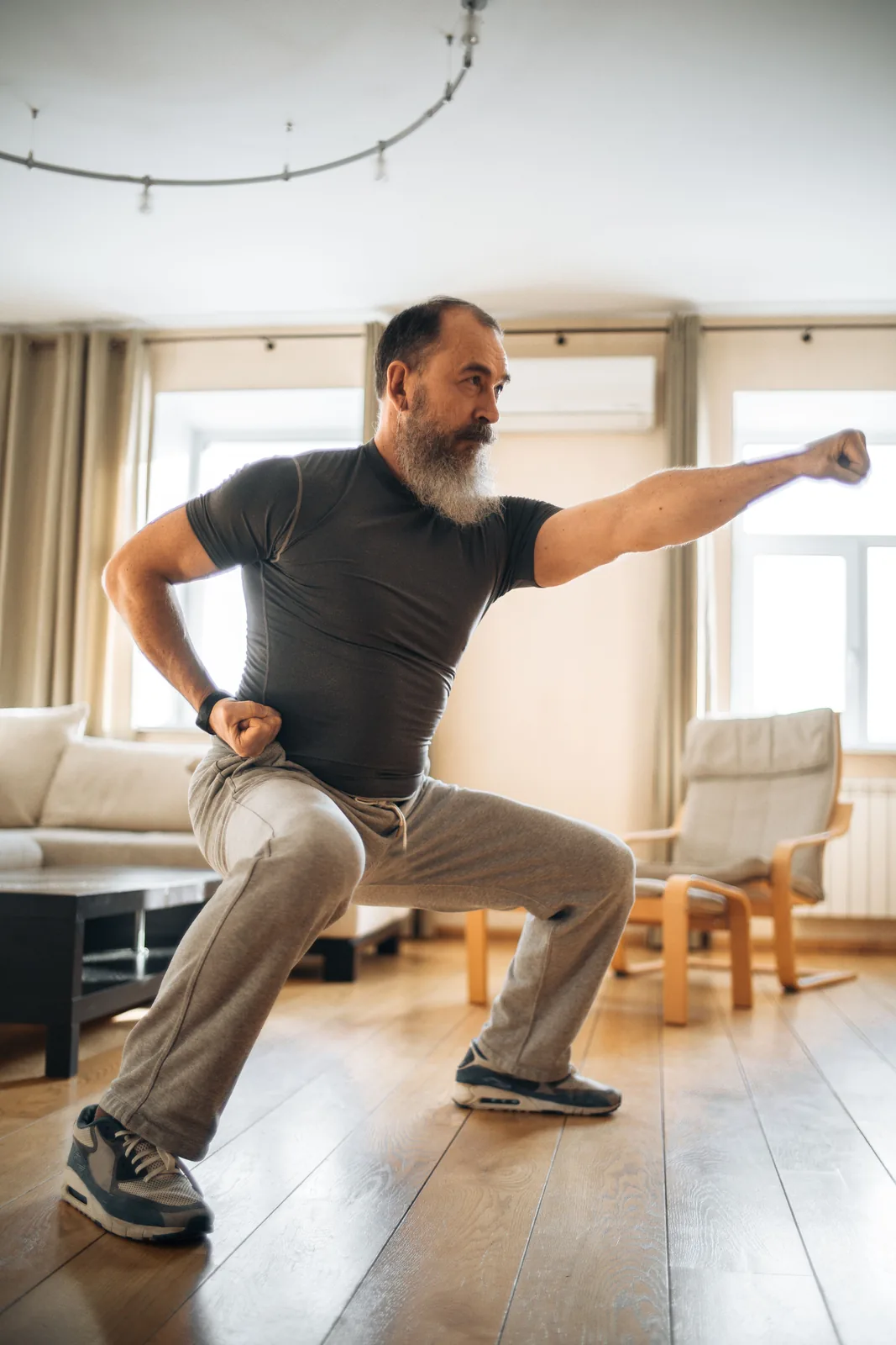 Active older man beginning a gentle morning movement routine