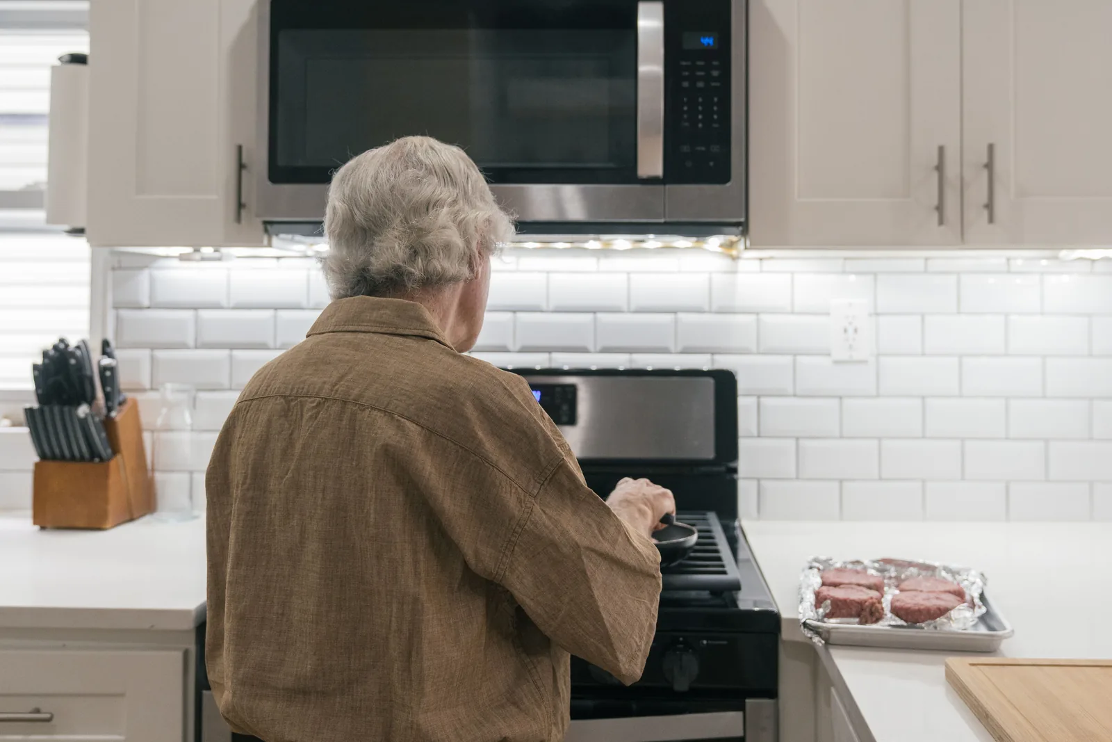 Older man preparing an everyday meal with fresh ingredients